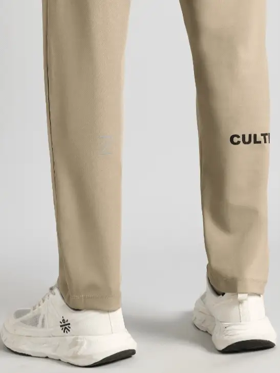 Men's Beige Runner's In Motion Graphic Trackpants - Image 9